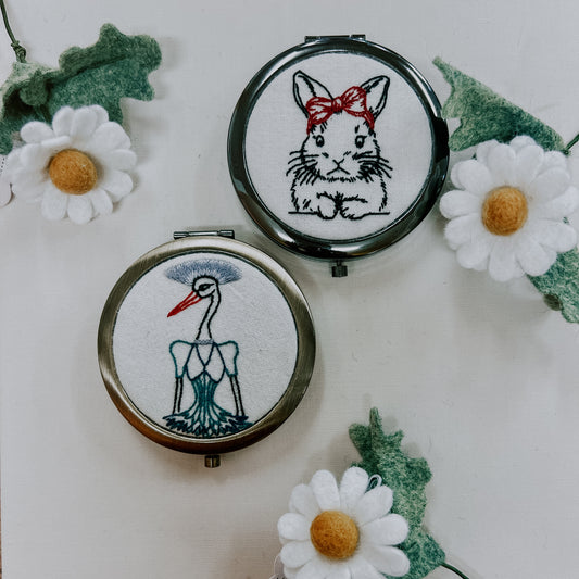 embroidered cosmetic mirror